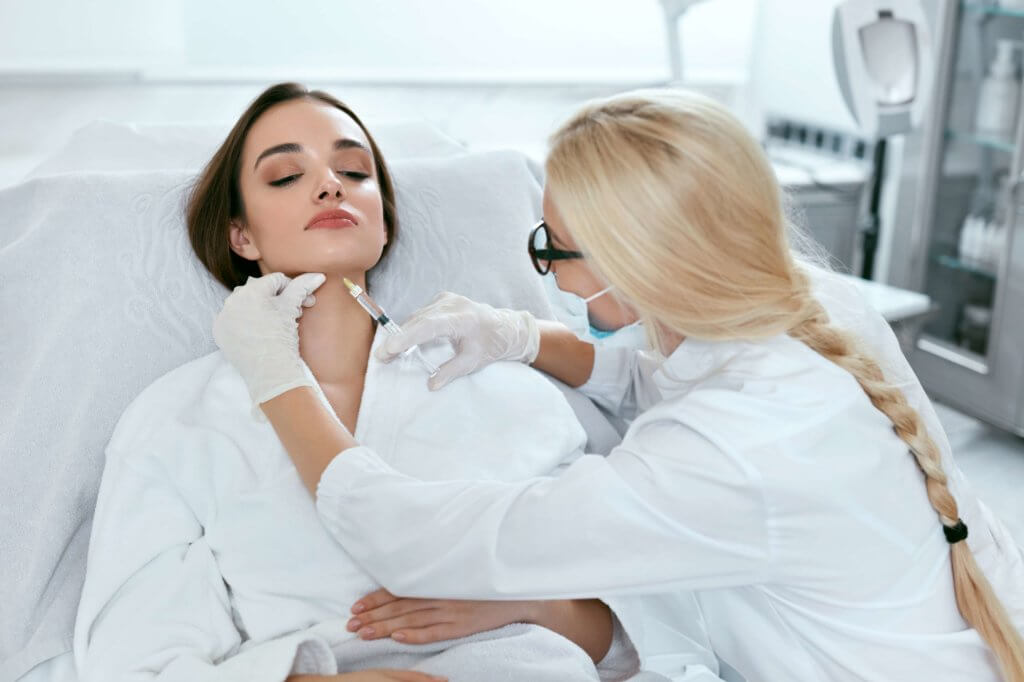 Woman taking BELKYRA™ skin treatment Skinceuticals | Skinlogicottawa | Ottawa