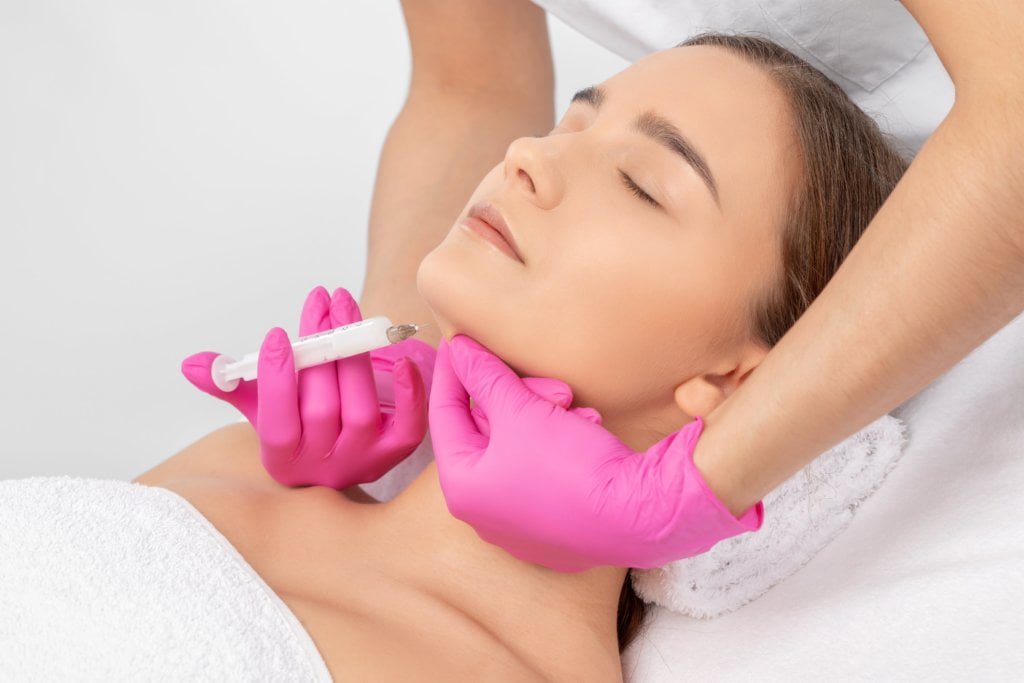 woman taking Belkyra™ treatment | Skinlogicottawa | Ottawa