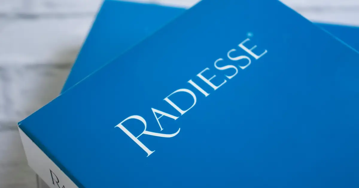 A blue box featuring the Radiesse® brand name in white text, shown from a slightly angled perspective, for Radiesse® in Ottawa, ON.